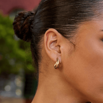 Radiant Gilded Teardrop Studs – FIORENE