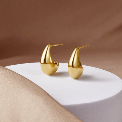 Radiant Gilded Teardrop Studs – FIORENE