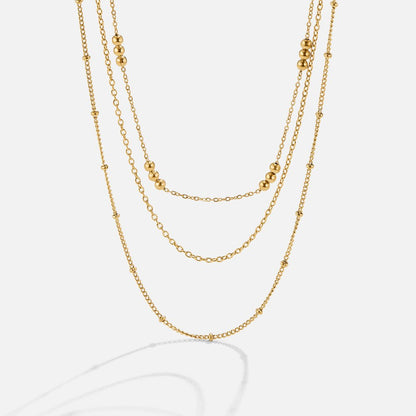 Golden Polished Bead Tiered Necklace – FIORENE